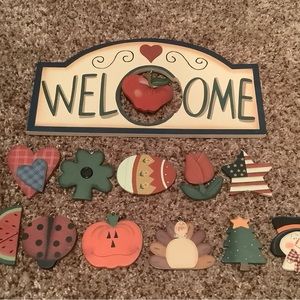 Little wood welcome sign with changeable hanging holiday ornaments